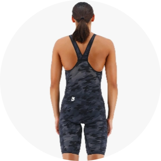 Female athlete wearing a black camouflage racing swimsuit with a racerback design. The suit provides full coverage and is ideal for competitive swimming.