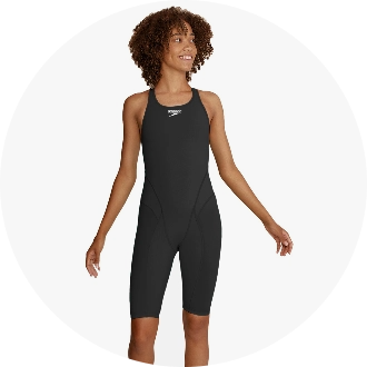 Woman wearing a sleek black competitive swimsuit with a racerback design, ideal for professional and amateur swimmers. The swimsuit features a comfortable fit and high-performance fabric for enhanced speed and mobility in the water.